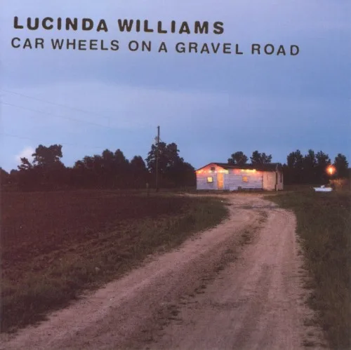 Car Wheels on a Gravel Road (1998)